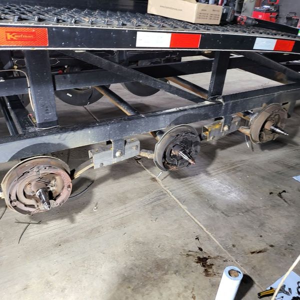 Car hauler trailer with wheels off in the bay
